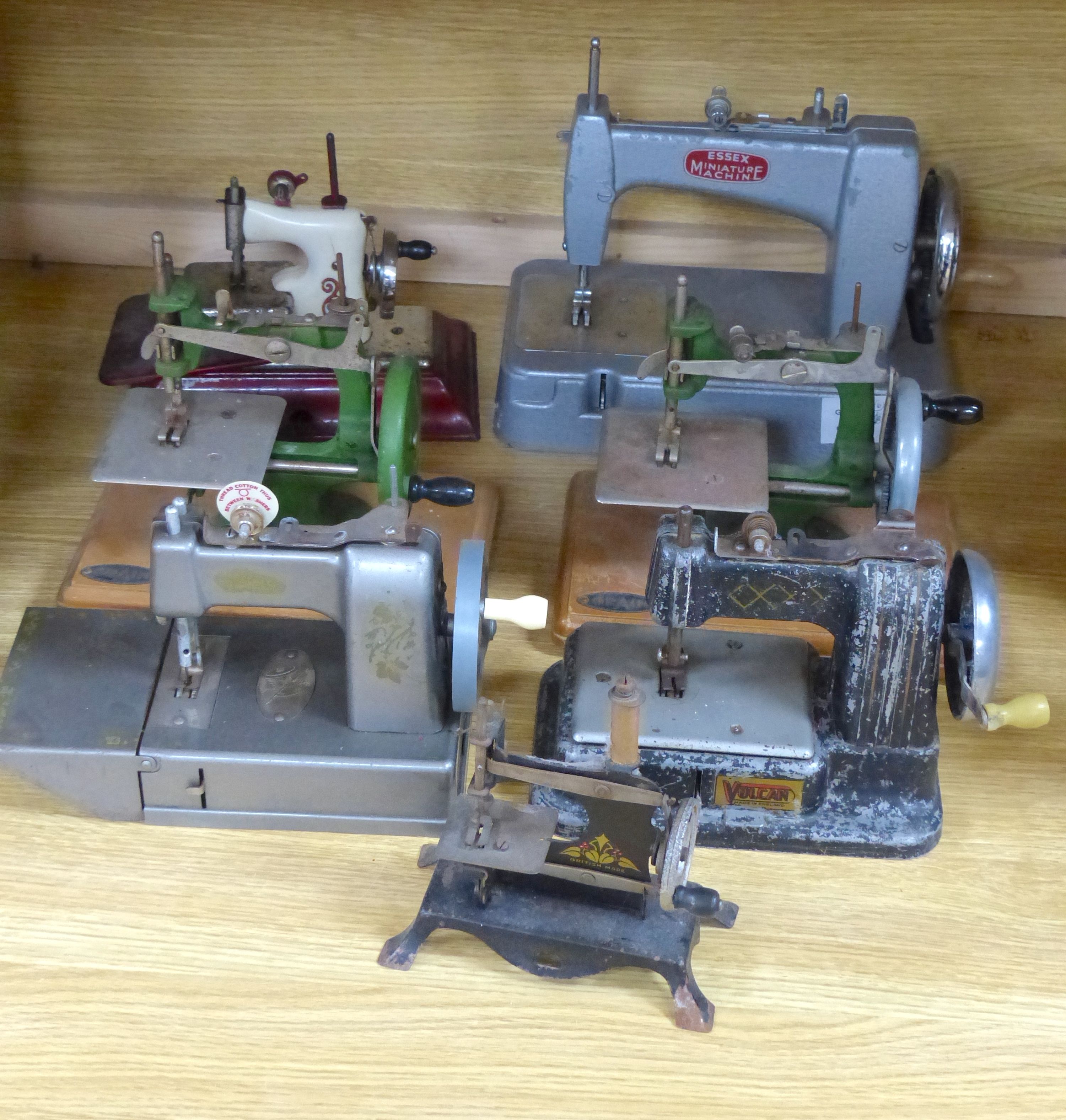 Six miniature sewing machines